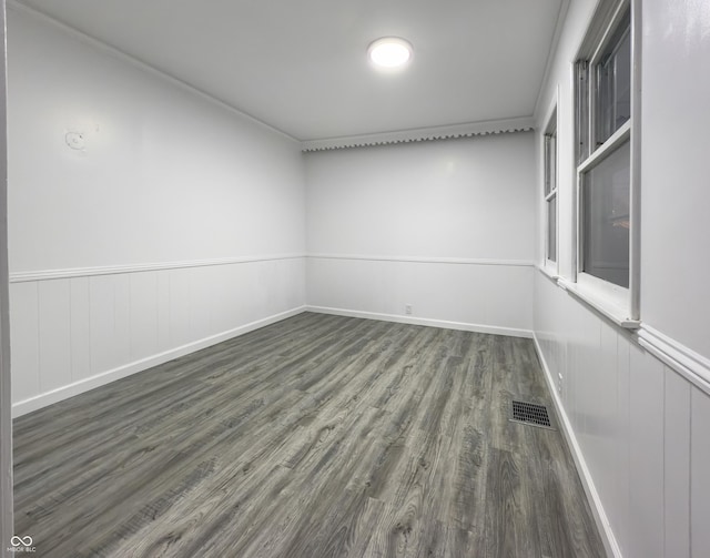 empty room with dark wood-type flooring