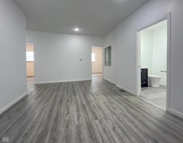 empty room with dark hardwood / wood-style floors