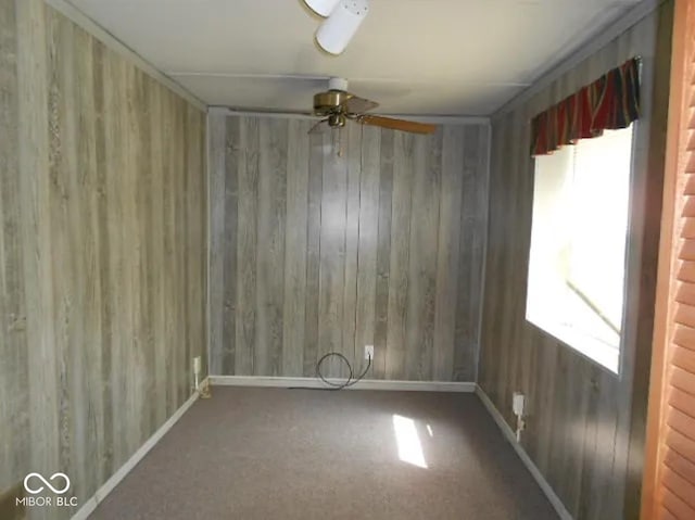 spare room with ceiling fan