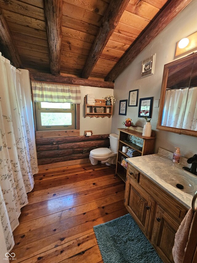 full bathroom with lofted ceiling with beams, toilet, wood finished floors, vanity, and wood ceiling