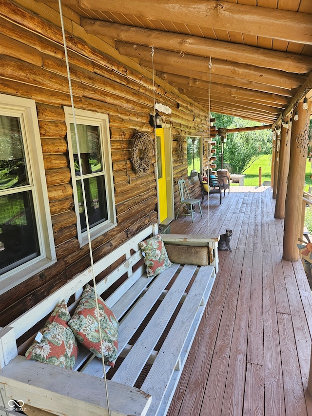 wooden terrace with a porch