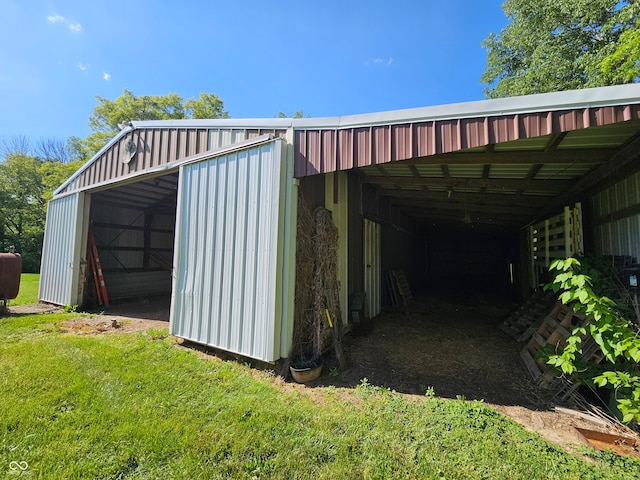 view of pole building with a lawn