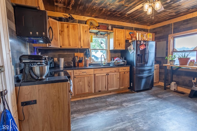 kitchen featuring dark hardwood / wood-style floors, sink, ceiling fan, stainless steel fridge with ice dispenser, and wooden ceiling