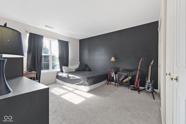 bedroom featuring light carpet