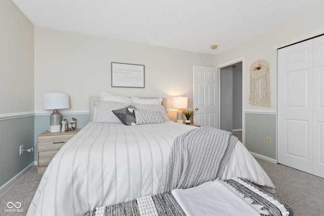 bedroom featuring a closet and carpet flooring