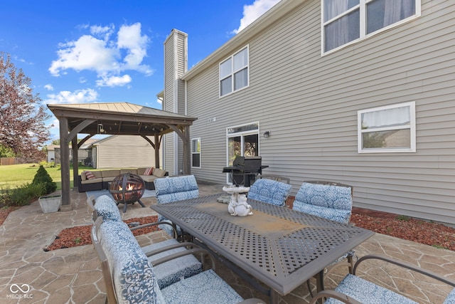 view of patio / terrace featuring an outdoor living space with a fire pit and a gazebo