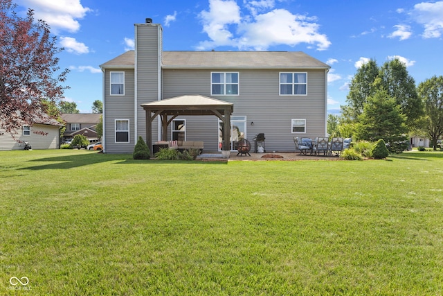 back of house featuring a patio area, a gazebo, and a yard