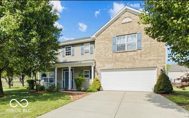 view of front of house with a front lawn, a porch, and a garage