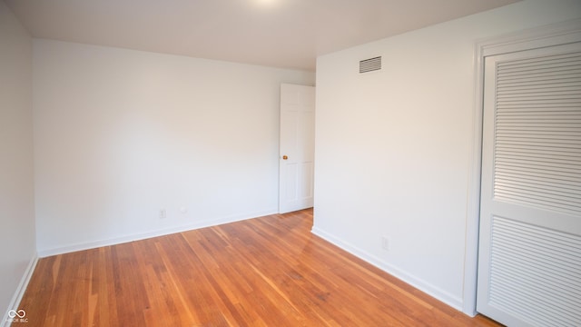 spare room featuring light wood-type flooring