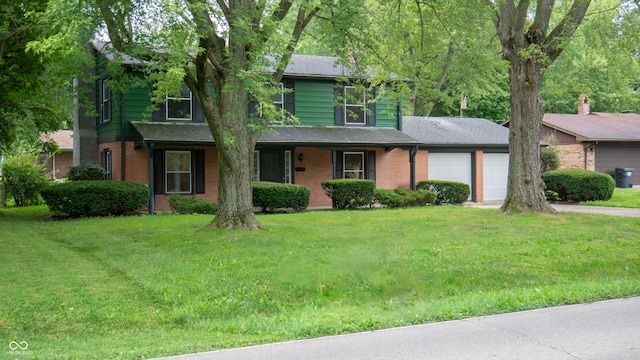 view of front facade featuring a garage and a front yard