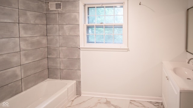 bathroom with vanity and bathtub / shower combination