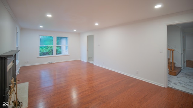 unfurnished living room featuring hardwood / wood-style floors