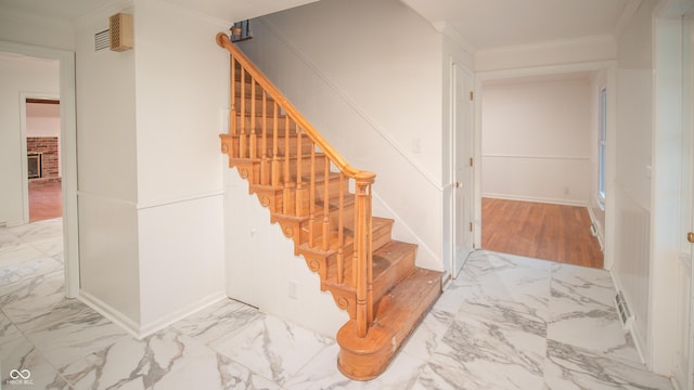 stairway with crown molding