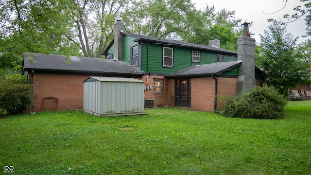 back of house featuring central AC, a yard, and a storage unit