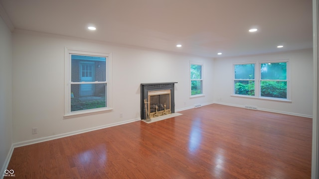 unfurnished living room with wood-type flooring