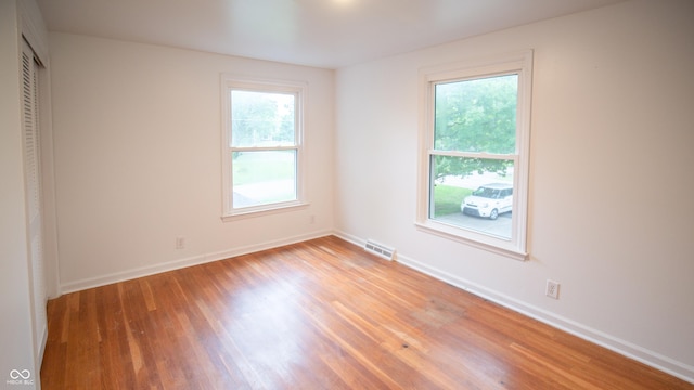 unfurnished room featuring light hardwood / wood-style flooring