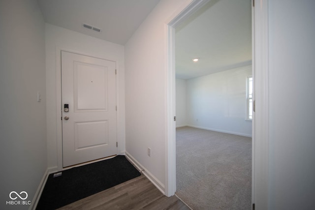 entryway featuring carpet flooring