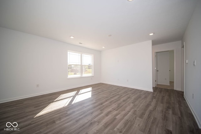 spare room featuring dark hardwood / wood-style floors