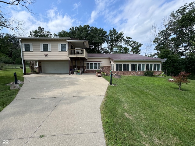 view of front of house with a garage and a front lawn