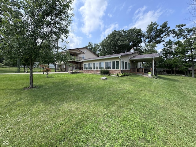 exterior space with a front yard and covered porch