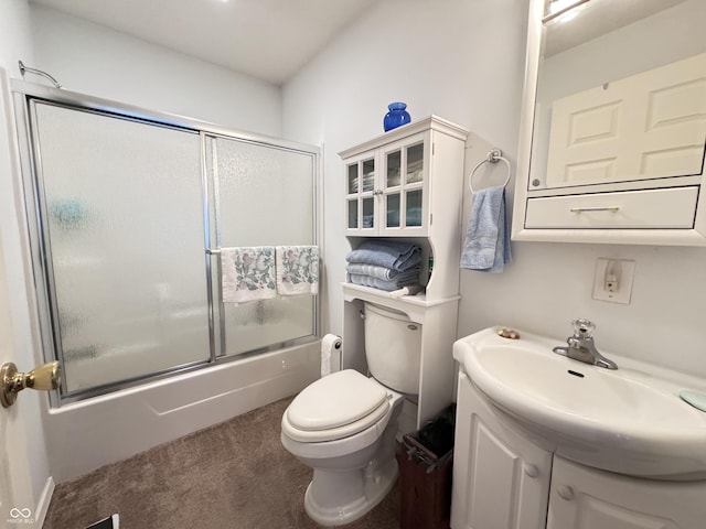 full bathroom featuring vanity, shower / bath combination with glass door, and toilet