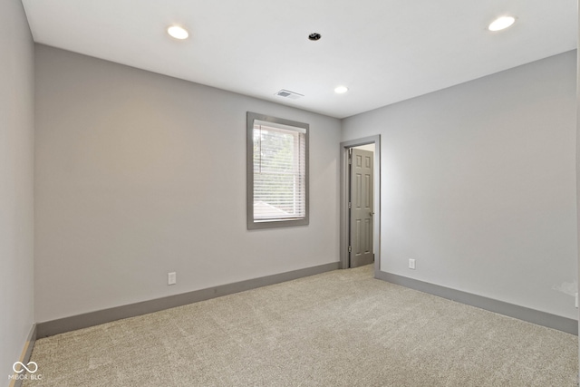 spare room featuring carpet flooring