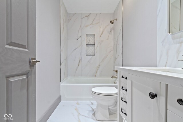 full bathroom featuring tile patterned flooring, toilet, tiled shower / bath combo, and vanity