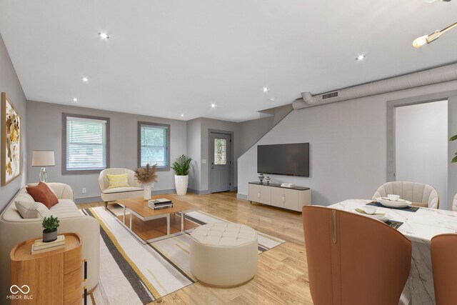 living room with light hardwood / wood-style floors