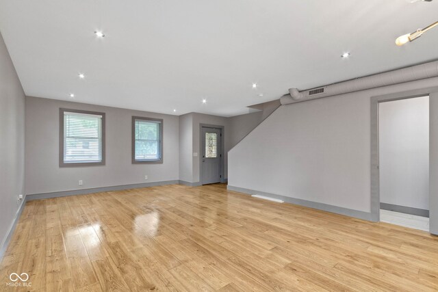 spare room with light hardwood / wood-style floors