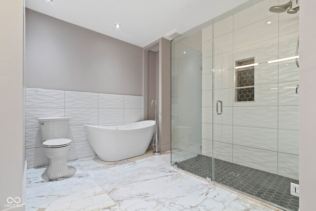 bathroom featuring toilet, walk in shower, tile patterned flooring, and tile walls