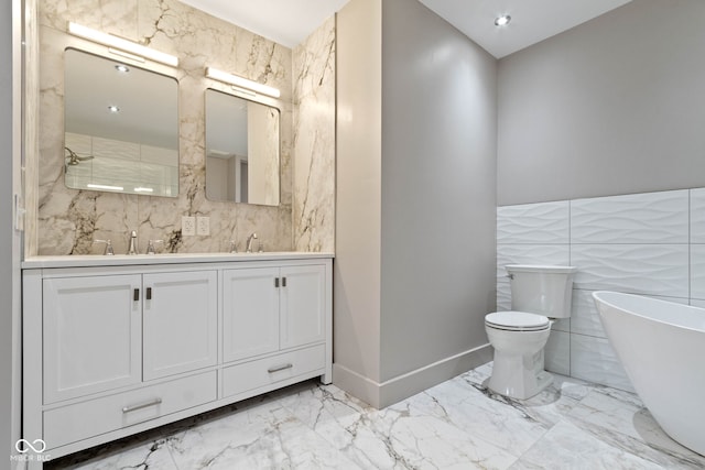 bathroom featuring toilet, double vanity, tile patterned flooring, and tile walls