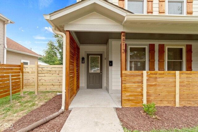 doorway to property with covered porch