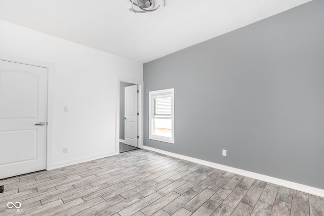 unfurnished room with light hardwood / wood-style flooring