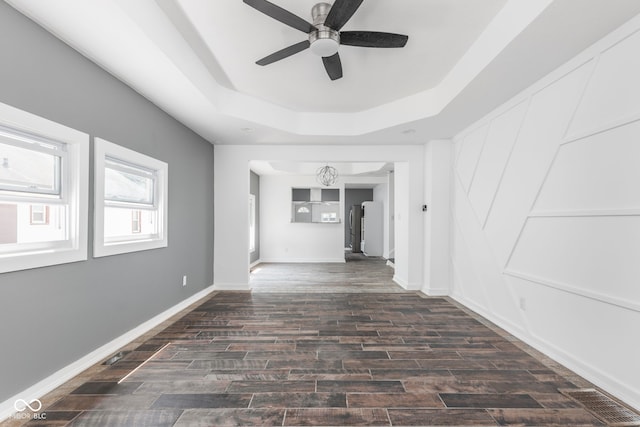 hall with a tray ceiling