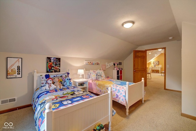 carpeted bedroom with lofted ceiling