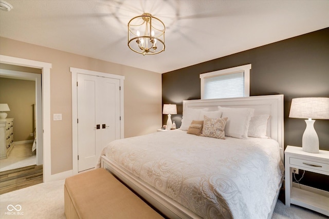 bedroom with a chandelier and a closet