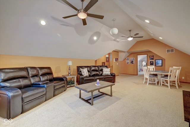 carpeted living room featuring lofted ceiling