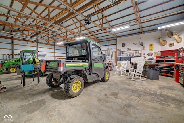 garage featuring a garage door opener and a workshop area