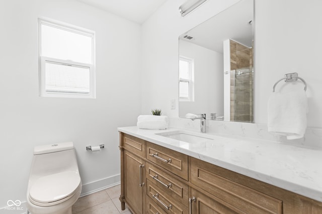 bathroom featuring vanity, tile patterned flooring, and toilet