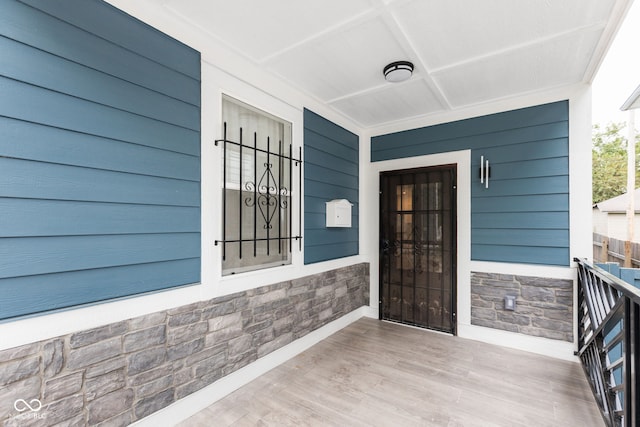 doorway to property featuring covered porch