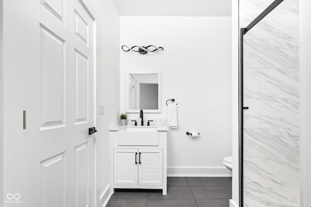 bathroom featuring tile patterned floors, vanity, and toilet