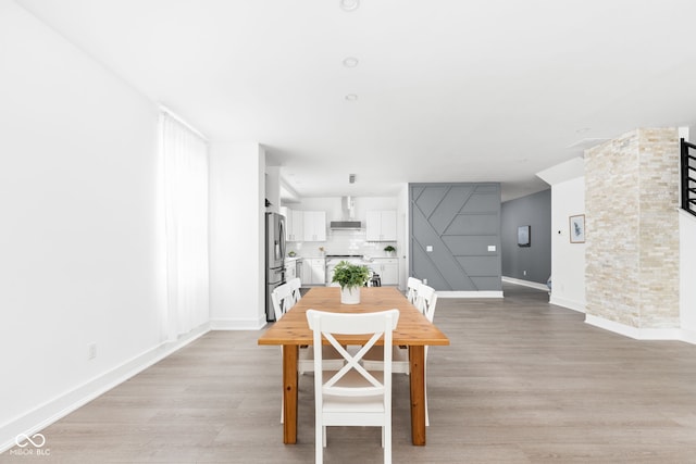 dining room with light hardwood / wood-style floors