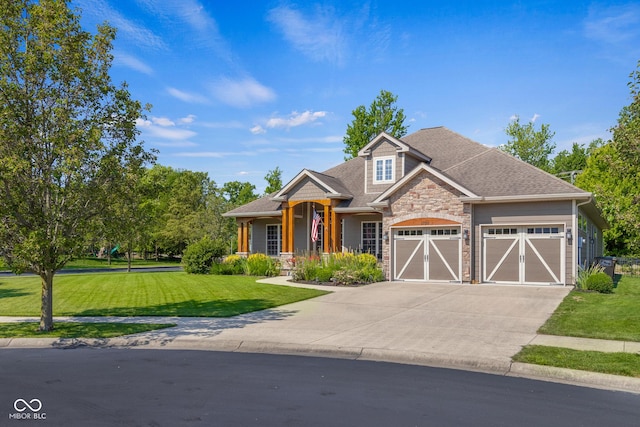 craftsman house with a garage and a front yard