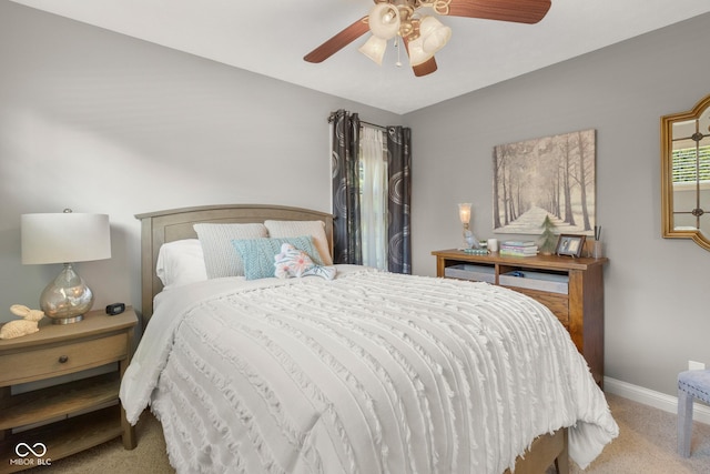 bedroom featuring ceiling fan and carpet