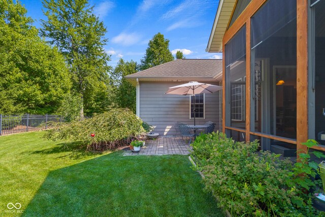 view of yard with a patio area and a sunroom