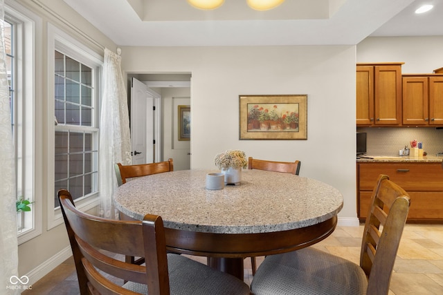 dining area with light tile patterned floors