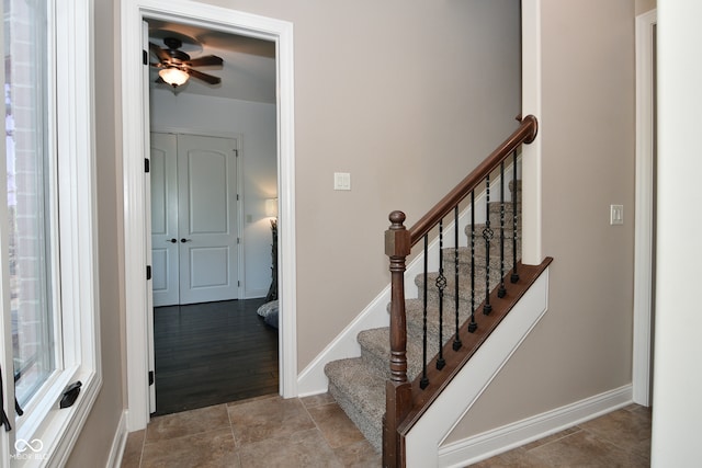 stairs with ceiling fan and wood-type flooring