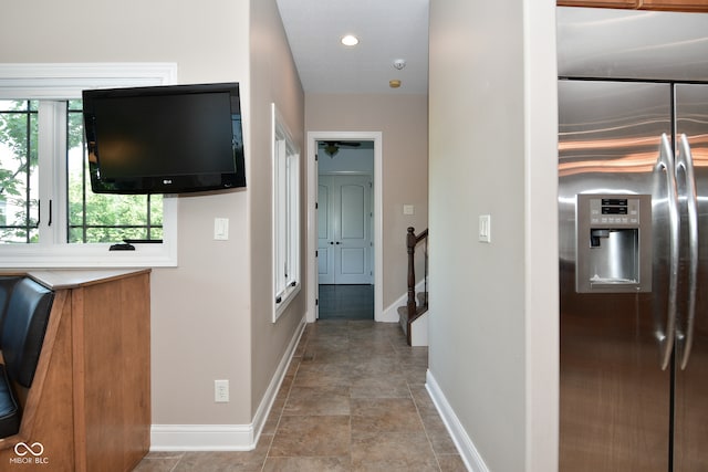 corridor with light tile patterned floors