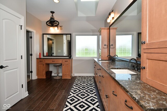 bathroom featuring dual vanity and wood-type flooring