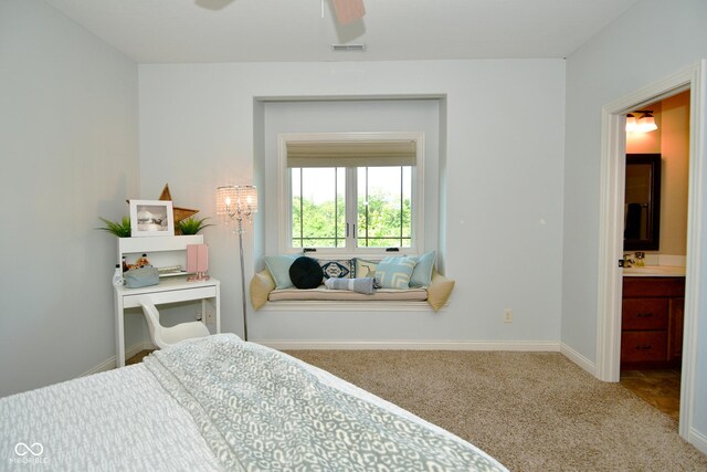 bedroom with connected bathroom, carpet, and ceiling fan